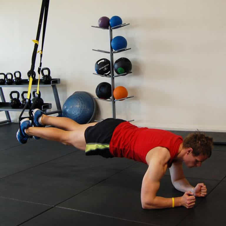 Man performing the TRX Plank